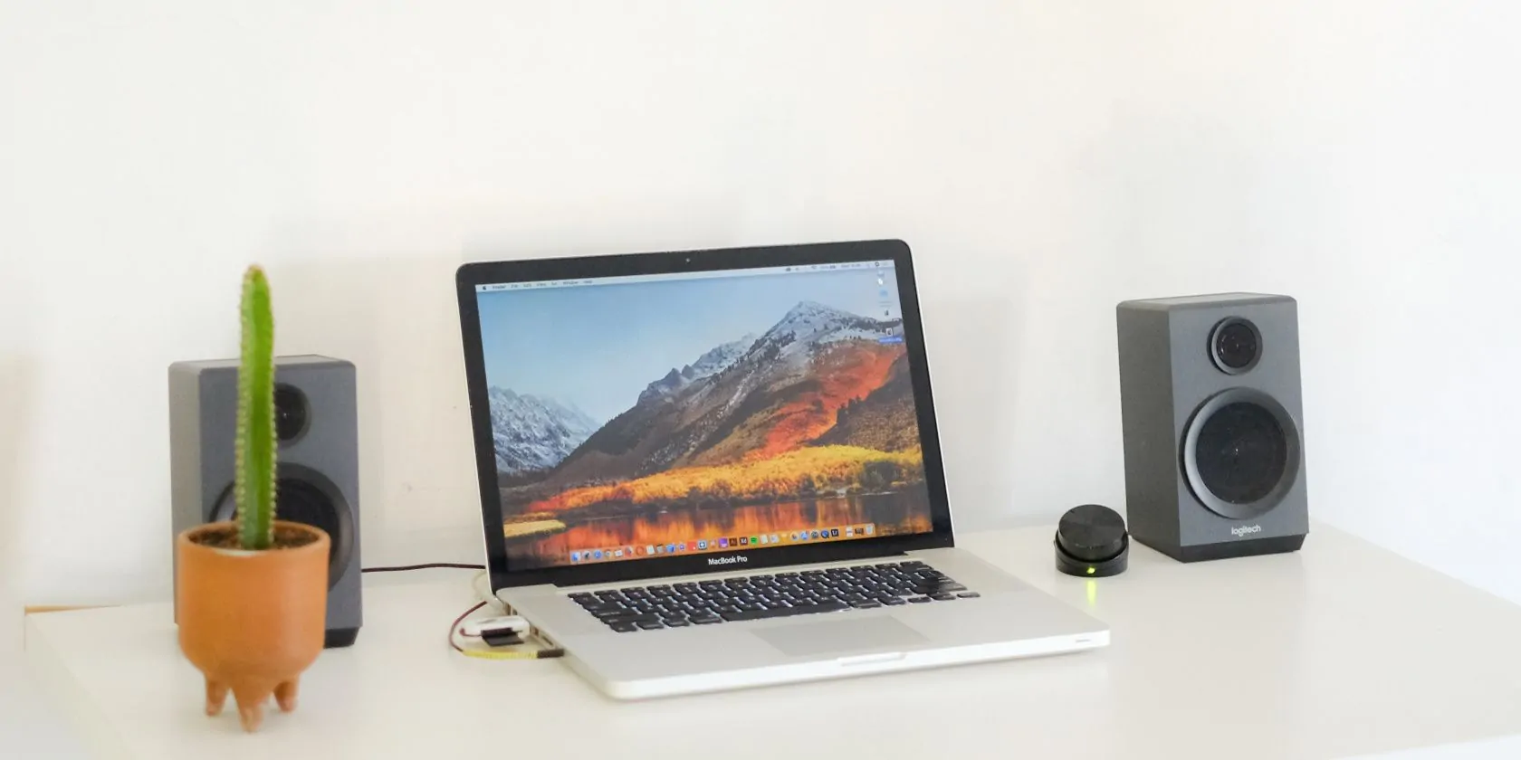 Jagonzalez.org | | Wireless Speakers Are Connected To The Laptop On A White Desk 1