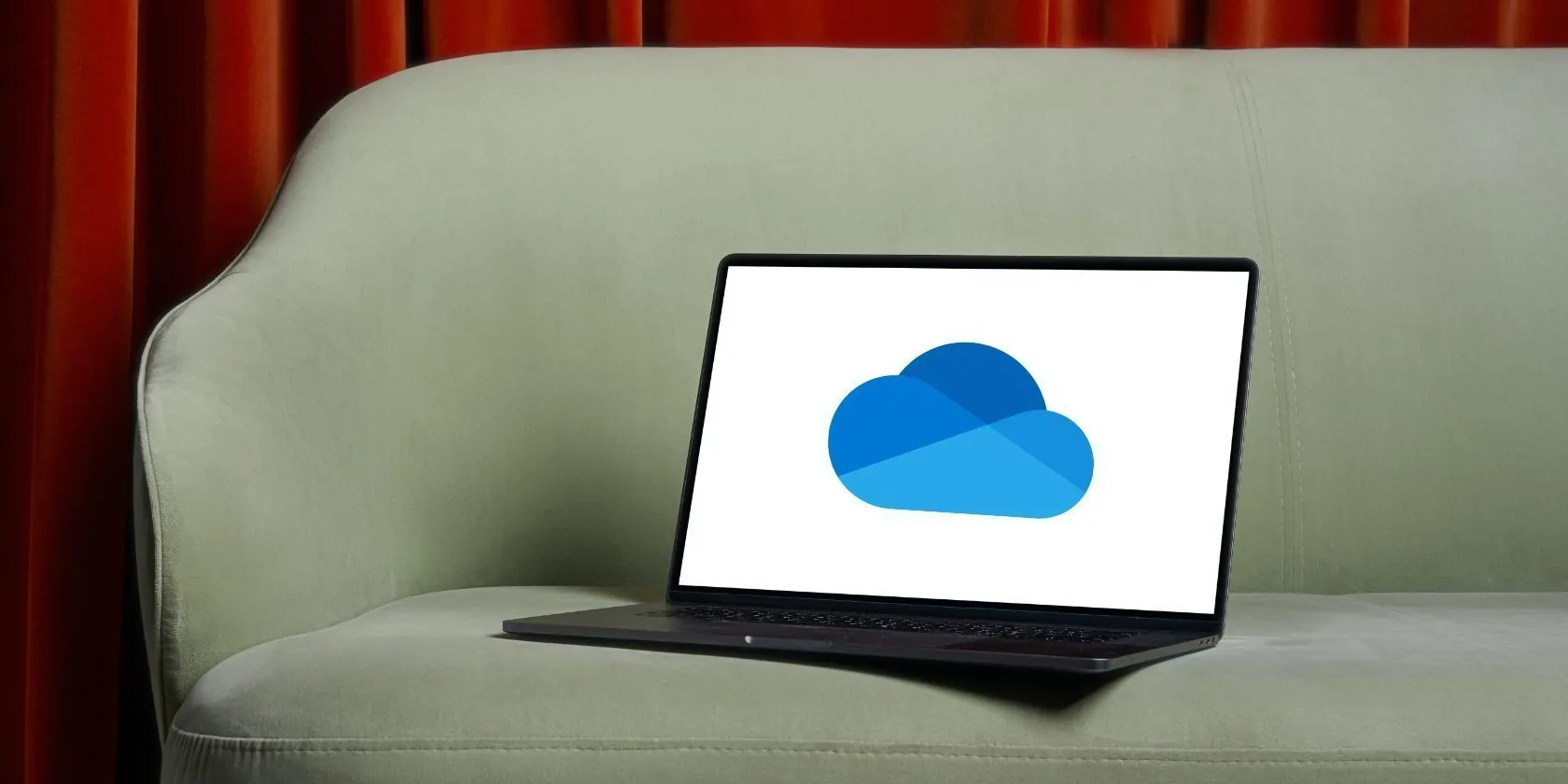 Jagonzalez.org | Iphone Hackeado | A Black Laptop On A Sofa With Onedrive Logo On It