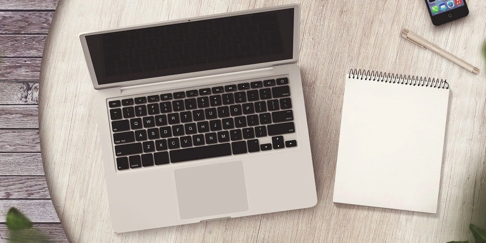 Jagonzalez.org | | A Silver Laptops With A Notepad On A Wooden Table